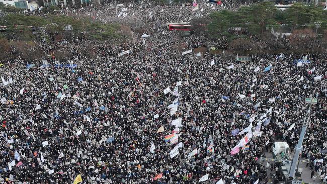 Protesters calling for the ouster of South Korea President Yoon Suk Yeol celebrating after the impeachment motion against Yoon was passed. Picture: Jung Yeon-je/AFP