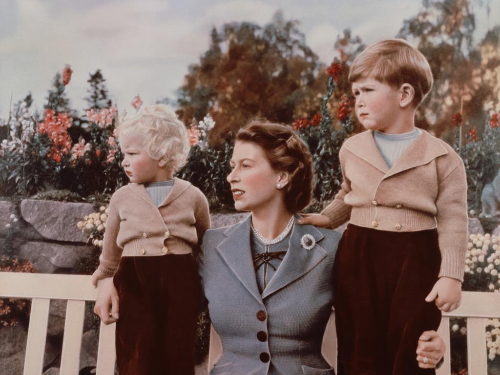 September 1952: Queen Elizabeth II with Prince Charles and Princess Anne in the grounds of Balmoral Castle, Scotland. Charles is celebrating his 4th birthday. (Photo by Lisa Sheridan/Studio Lisa/Getty Images)