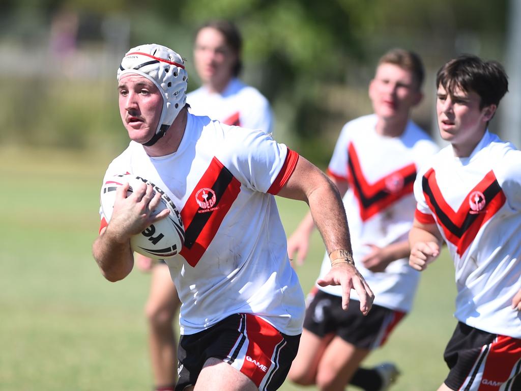 Boys Rugby League State Championship held at Northern Division, Brothers Leagues ground, Townsville. South West (black) v Wide Bay (white). 16-18 years. 16-18 years. Blaine Watson of Gympie SHS.