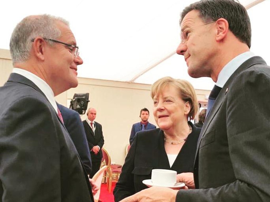 Scott Morrison, German Chancellor Angela Merkel and Dutch PM Mark Rutte commemorate the 75th anniversary of D-Day, in Portsmouth, Britain. Source: Supplied