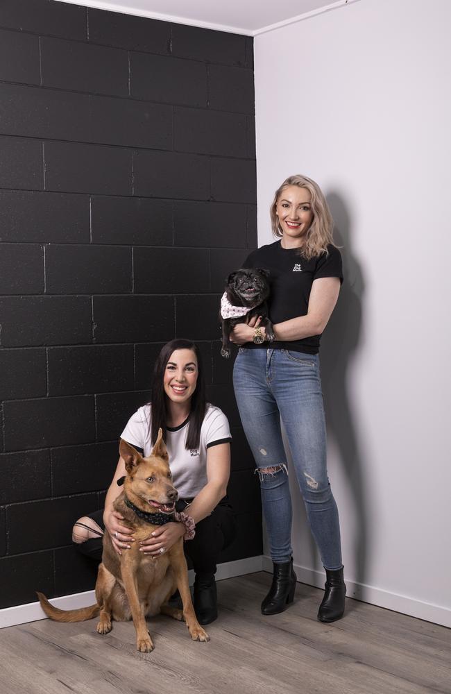 Emma Karanges, with Boss, the kelpie, and Jasmin Robertson, with Frankie, the pug, became business partners during the pandemic and are thriving. Picture: Mark Cranitch