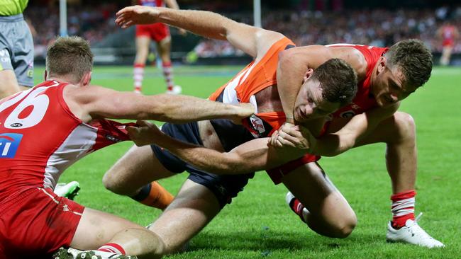 Tom Papley grabs Heath Shaw in a headlock before the Giant defender’s slur. Picture: Gregg Porteous