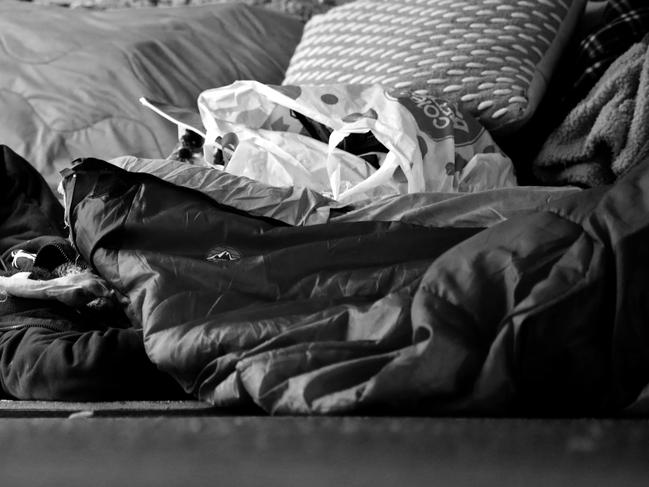 SYDNEY, AUSTRALIA - NewsWire Photos DECEMBER 14, 2020: A homeless person pictured sleeping at Town Hall, Sydney CBD.Picture: NCA NewsWire / Damian Shaw