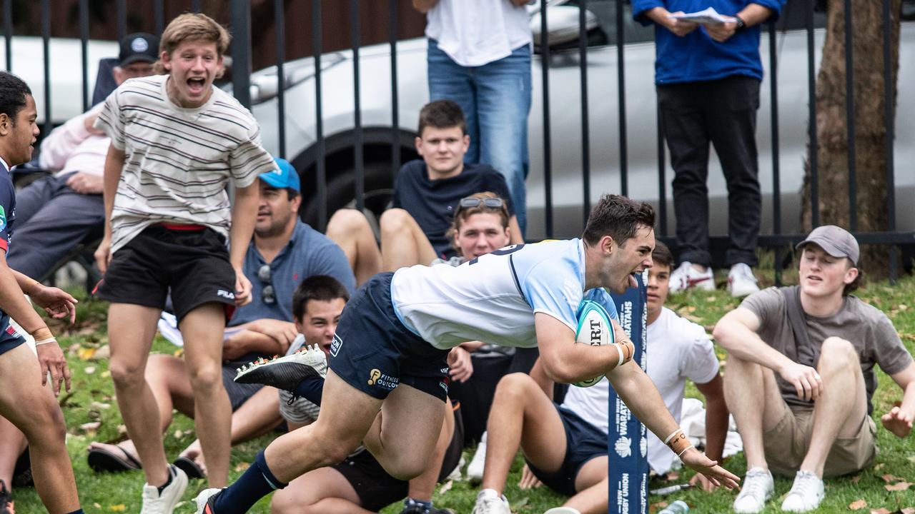 Zach Fittler scoring to the delight of fans in the match between the NSW Waratahs and Melbourne Rebels Academy teams two years ago. Pics: Julian Andrews