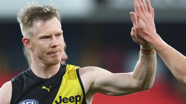 GOLD COAST, AUSTRALIA - JULY 18: Jack Riewoldt and Nathan Broad of the Tigers walks celebrate winning the round 7 AFL match between the Richmond Tigers and the North Melbourne Kangaroos at Metricon Stadium on July 18, 2020 in Gold Coast, Australia. (Photo by Chris Hyde/Getty Images)