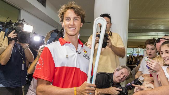 The next stop for the Queen’s Baton, pictured here with Olympic swimmer Cam McEvoy, will be the fourt Ashes test at the MCG on Boxing Day. Picture: Glenn Hunt/AAP