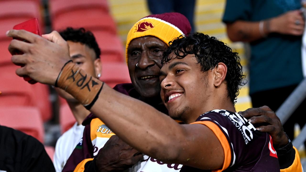 BRISBANE, AUSTRALIA – APRIL 28: Selwyn Cobbo of the Broncos celebrates with a fan after the round eight NRL match between the Brisbane Broncos and the Cronulla Sharks at Suncorp Stadium, on April 28, 2022, in Brisbane, Australia. (Photo by Bradley Kanaris/Getty Images)