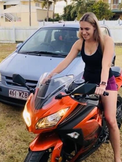 Jennifer Board on the motorcycle she was riding when she was struck and killed in Townsville on Friday.