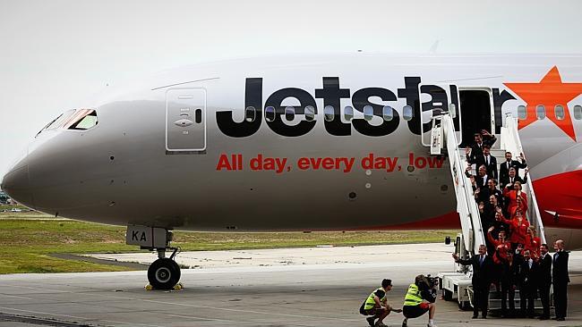 Photo: Hamish Blair Qantas CEO Alan Joyce, Jetstar CEO Jayne Hrdlicka and the flight crew are welcomed by Victorian premier Denis Napthine as Jetstar's new 787 Dreamliner arrives at the hangar at Melbourne Airport on October 9, 2013 in Melbourne, Australia