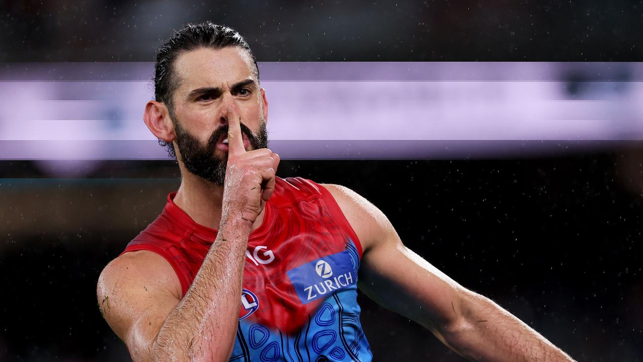 Brodie Grundy silences the fans. (Photo by James Elsby/AFL Photos via Getty Images)