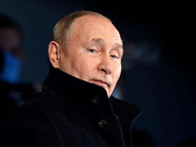 TOPSHOT - Russia's President Vladimir Putin looks on during the opening ceremony of the Beijing 2022 Winter Olympic Games, at the National Stadium, known as the Bird's Nest, in Beijing, on February 4, 2022. (Photo by WANG Zhao / AFP)