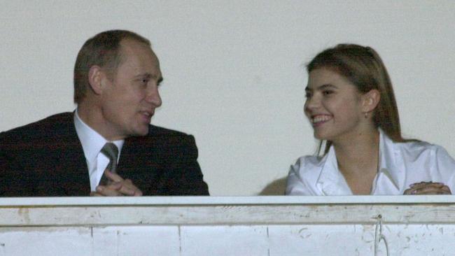 Vladimir Putin talking to Alina Kabaeva. Picture: TASS via Getty Images