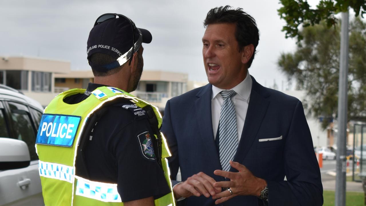 Police minister Dan Purdie speaking to a police officer conducting roadside breath tests on Alexandra Parade, Alexandra Headland.