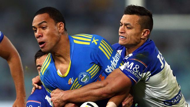 Will Hopoate of the Eels is tackled by Sam Perrett of the Bulldogs during the round 23 NRL match.