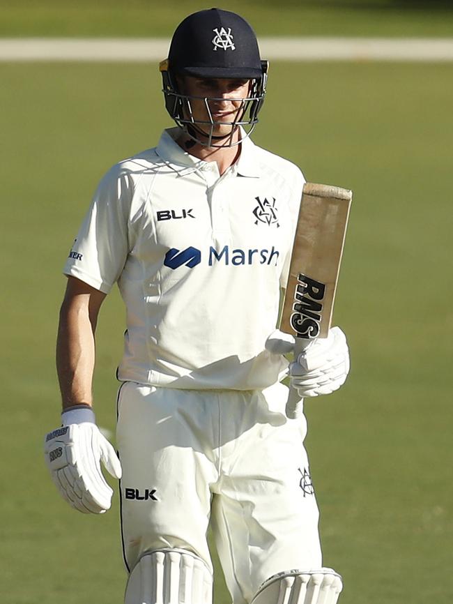 James Seymour raises his bat after scoring a debut half-century. Picture: Darrian Traynor