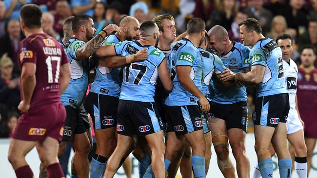 NSW Blues players celebrate a try during Game one of the State of Origin series against the Queensland Maroons at Suncorp Stadium.