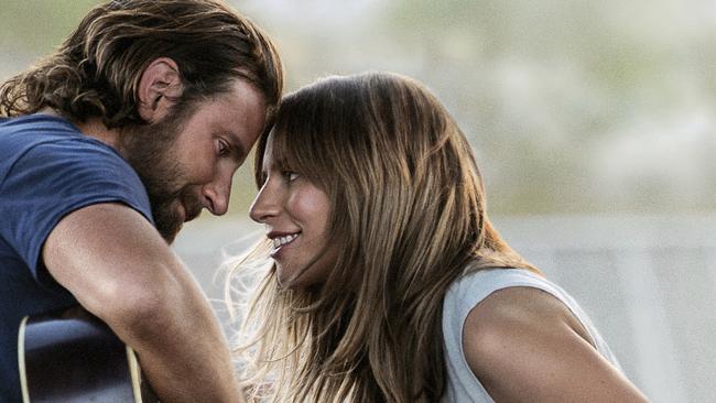 This image released by Warner Bros. Pictures shows Bradley Cooper, left, and Lady Gaga in a scene from "A Star is Born." (Warner Bros. Pictures via AP)