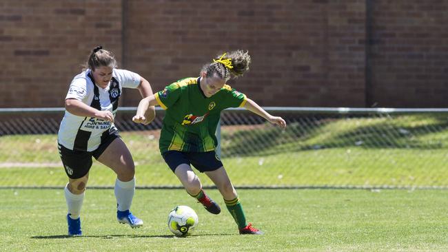 Willowburn player Jacinda Reed (left) and Hayley Warner of Highfields in Toowoomba Football League Premier Women grand final at Clive Berghofer Stadium, Sunday, November 15, 2020. Picture: Kevin Farmer