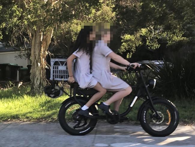 Secondary school students on an e-bike on a shared path in Manly, without helmets, where locals have been complaining about bikes speeding along footpaths at up to 30km/h. Picture: Manly Daily