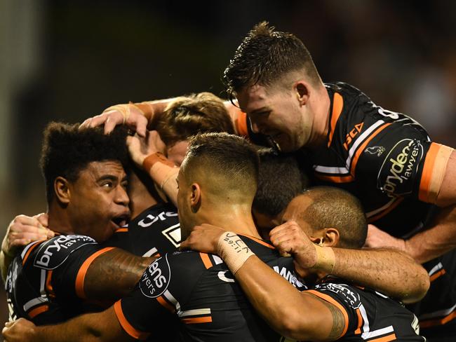 Tigers celebrate after a try to Michael Chee Kam.