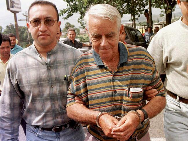 Infamous paedophile Robert “Dolly” Dunn wearing handcuffs while being escorted to Toncontin Airport in Tegucigalpa, Honduras following his arrest in November 1997.