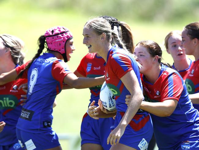 Knights celebrate with Lily McNamara. Picture: Michael Gorton