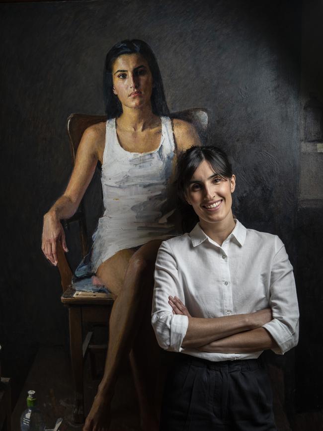 Tsering Hannaford with a portrait of her painted by father Robert Hannaford. Picture: Sarah Reed