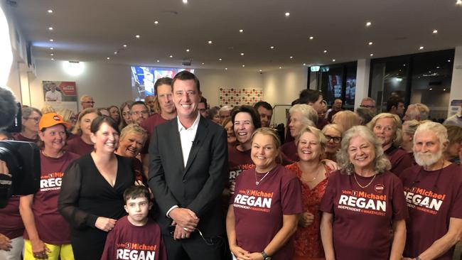 The victorious winning independent candidate in Wakehurst, Michael Regan, flanked by supporters at the Manly Warringah Football Club at Cromer after grabbing the safe seat from the Liberals. Picture: Jim O'Rourke