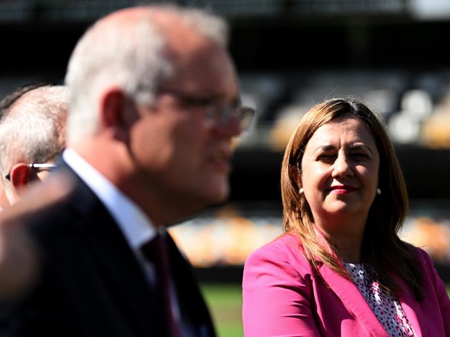 BRISBANE, AUSTRALIA - NewsWire Photos - MARCH 21, 2022.Prime Minister Scott Morrison (centre) watched by Queensland Premier Annastacia Palaszczuk during a visit to the Gabba Stadium in Brisbane to announce the SEQ City Deal.Picture: NCA NewsWire / Dan Peled