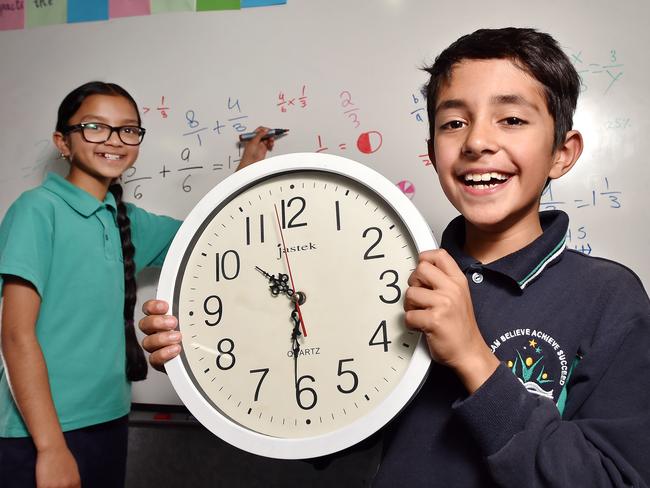 Students Ria (left) and Arnav (right) at Glen Waverley Primary School in Melbourne. A simpler syllabus to start next year will mean students would not be taught to tell the time until Year 2. Picture: Nicki Connolly