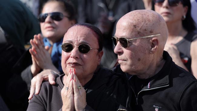 A woman reacts as she watches with others gathered at Tel Aviv's ’Hostages Square’. Picture: AFP