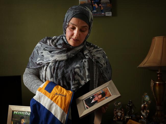 Maha Dunia with a photo of her murdered son Mahmoud Hrouk.