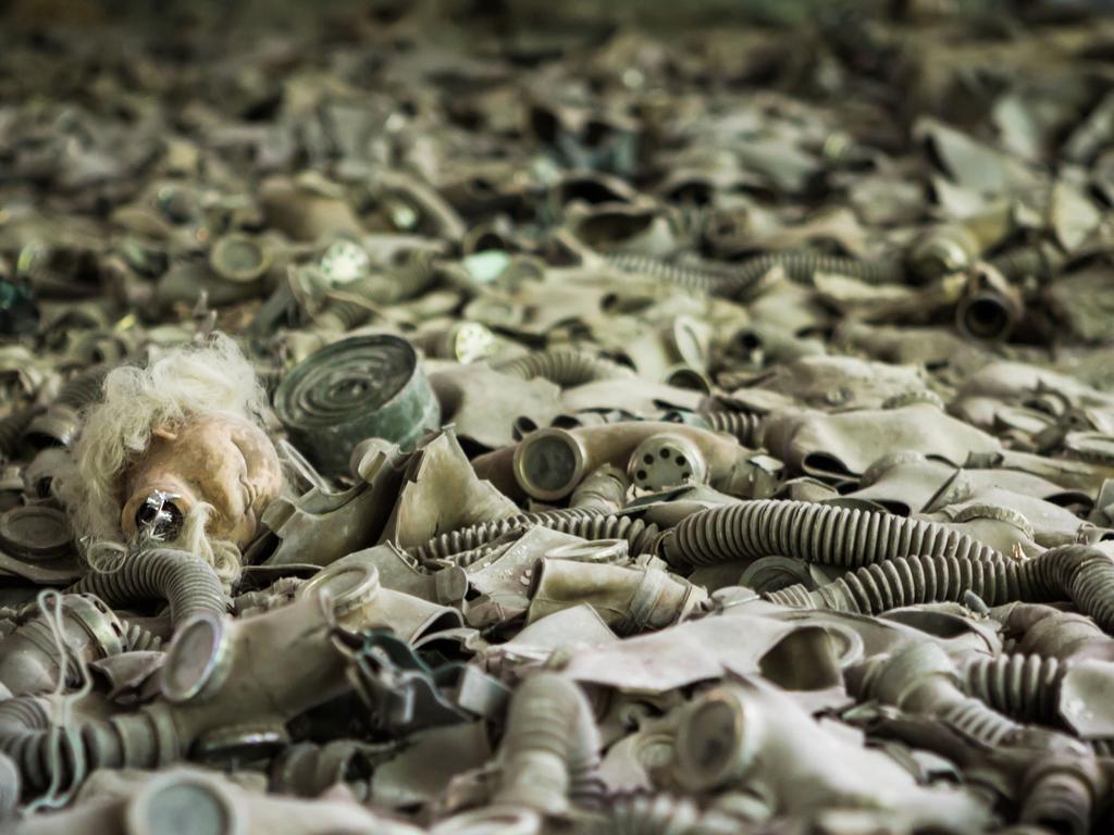 Dozens of Cold War gasmasks line the floor in an elementary school. Picture: Erwin Zwaan