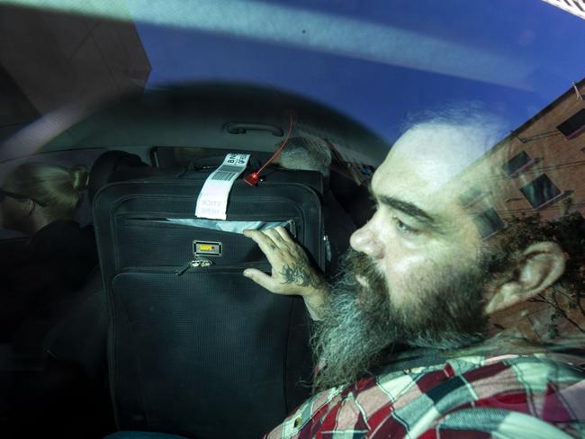 Jason Cooper, 44, arrives at the Roma Street watch house. Picture: AAP Image/Glenn Hunt