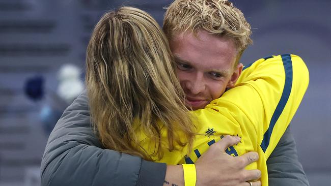 Emma McKeon gets a hug from boyfriend Cody Simpson after her gold medal performance. Picture: Michael Klein