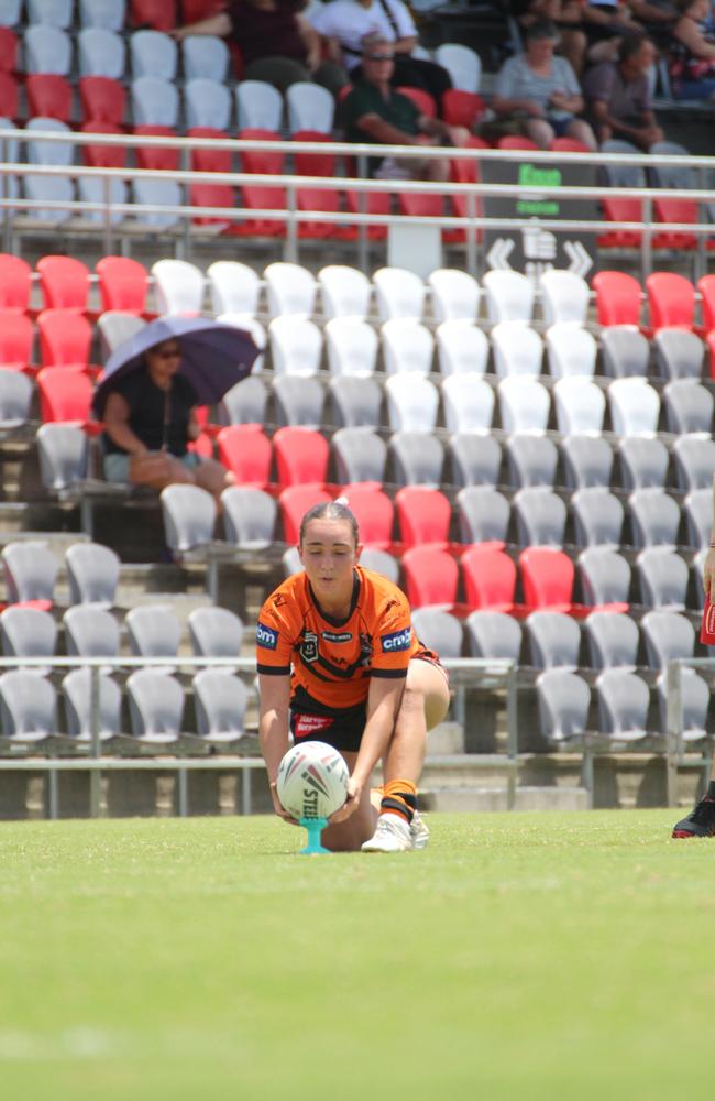 Enah Desic kicking for goal for the Tigers in the Harvey Norman under-17s