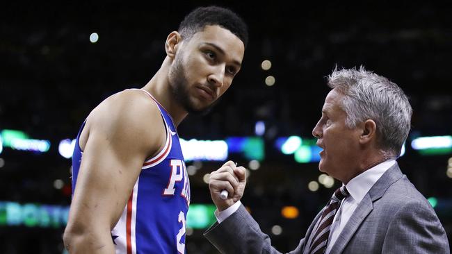 Philadelphia 76ers coach Brett Brown, right, talks with guard Ben Simmons.