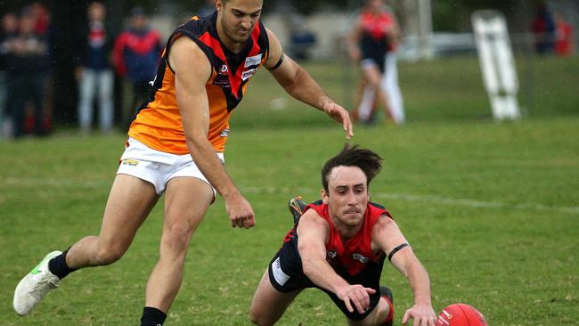 Sam Laffan shows plenty of desperation for the Demons. Picture: Hamish Blair