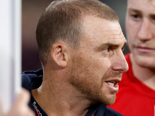 MELBOURNE, AUSTRALIA - APRIL 11: Simon Goodwin, Senior Coach of the Demons addresses his players during the 2024 AFL Round 05 match between the Melbourne Demons and the Brisbane Lions at the Melbourne Cricket Ground on April 11, 2024 in Melbourne, Australia. (Photo by Michael Willson/AFL Photos via Getty Images)