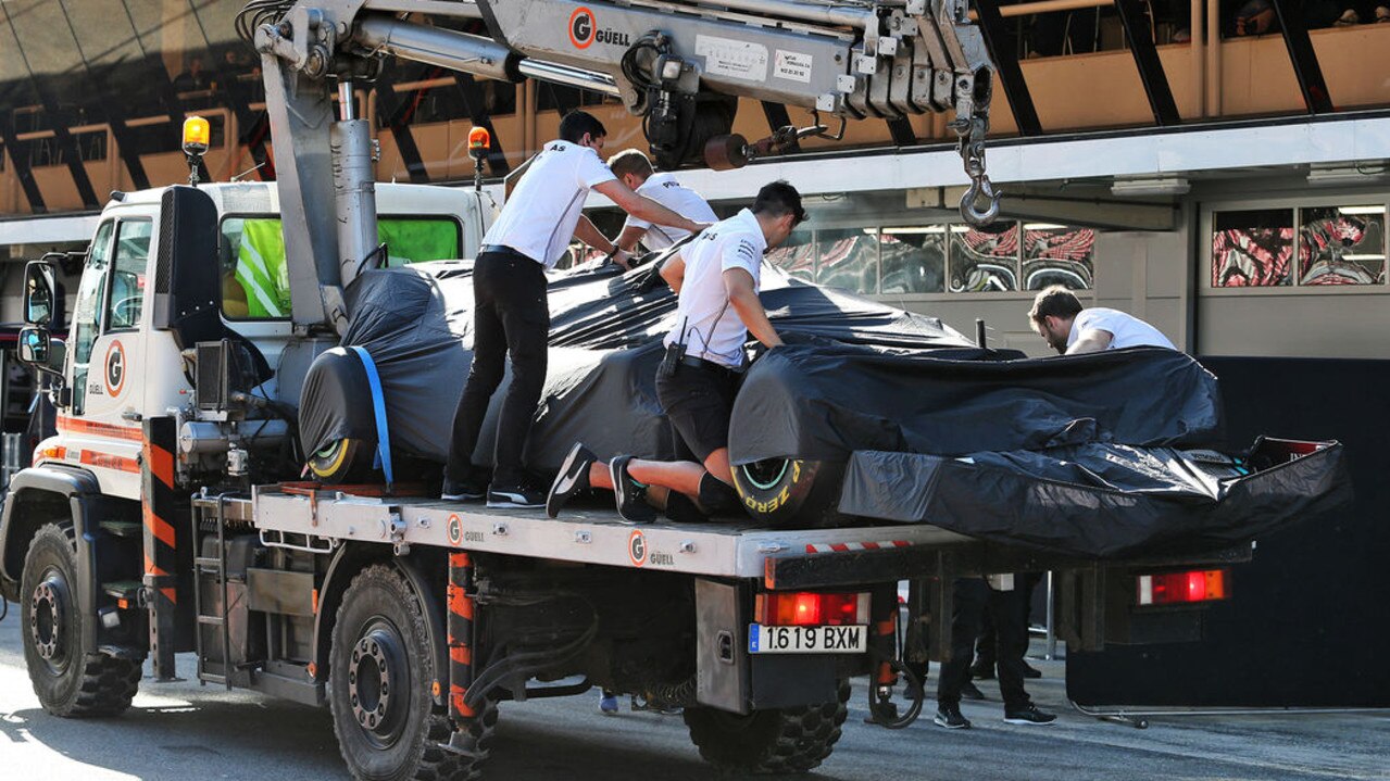 Lewis Hamilton's W11 is brought back to the lane. Pic: XPB