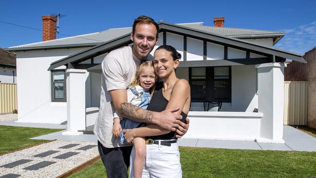 Kellie and Jeremy Finlayson with their daughter Sophia, 3, outside the Hendon home they are selling. Picture: Mark Brake