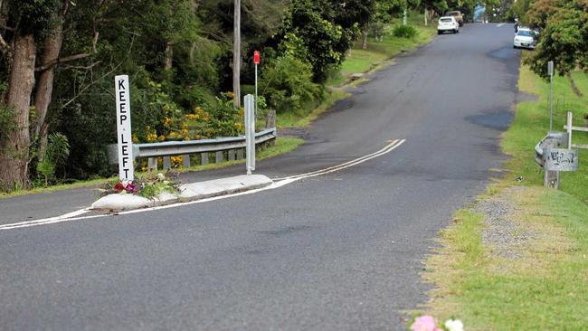 Flowers on Cecil St, Nimbin, where a pedestrian was fatally struck by a vehicle in an alleged hit-and-run incident On Monday, April 15. Picture: Liana Turner