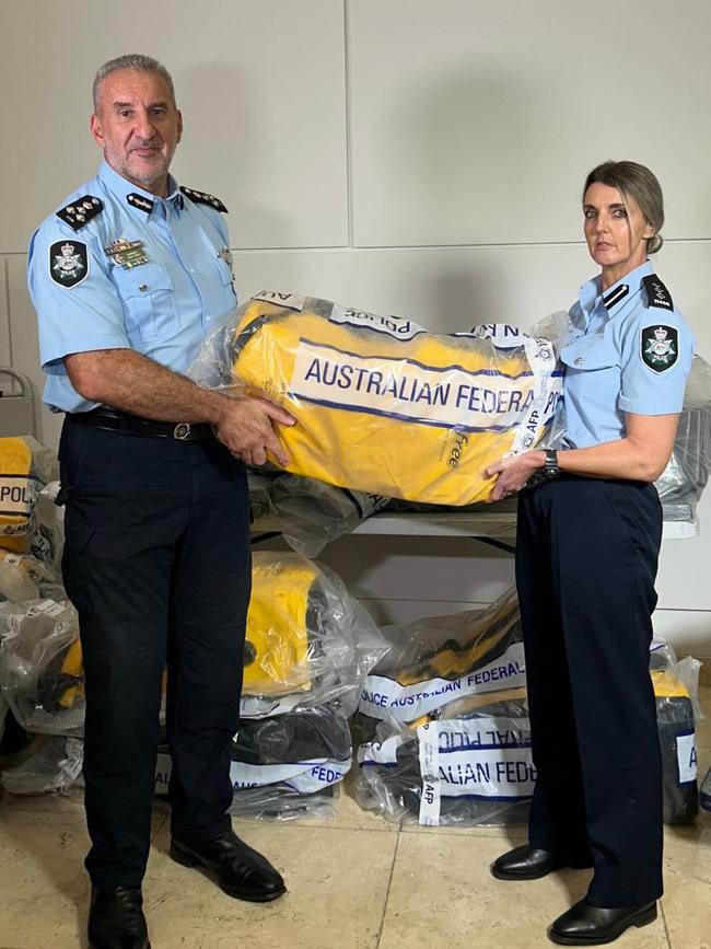 Police with some of the bags allegedly full of cocaine. Picture: Australian Federal Police