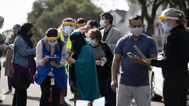 Residents queue up at the new vaccination hub next to the Greek Orthodox Church in Belmore on Wednesday. Picture: Nikki Short