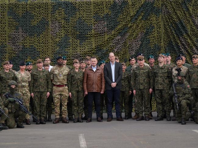 Prince William and Polish Deputy Prime Minister Mariusz Blaszczak with troops near the Ukrainian border. Picture: Getty Images