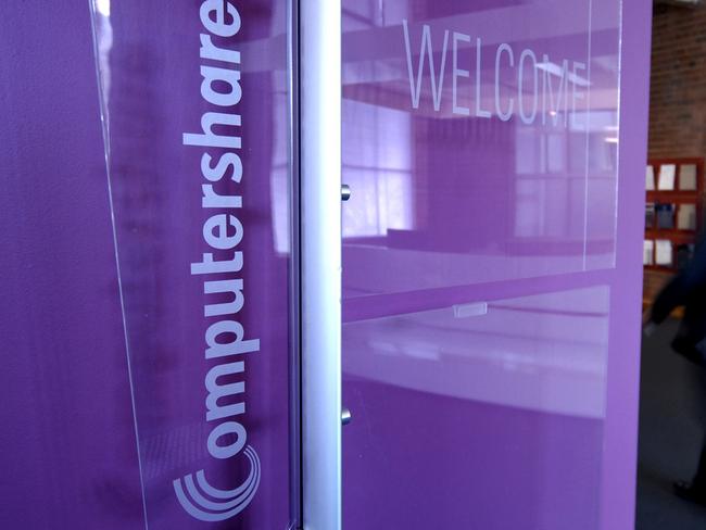 A pedestrian walks past a Computershare sign displayed at their head offices in Melbourne, Australia, on Wednesday, Feb. 13, 2008. Computershare Ltd., the world's biggest share registrar, advanced the most in three months in Sydney trading as earnings topped analysts' estimates, led by a surge in initial share sales in Hong Kong. Photographer: Carla Gottgens/Bloomberg News