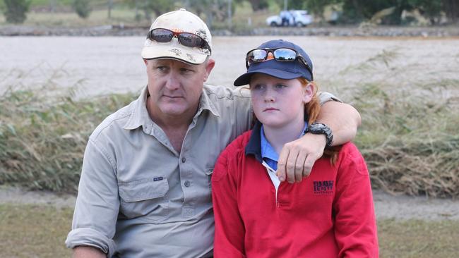 Matt Grinham with his daughter Sophie Grinham. Mr Grinham raced to help the family but the car quickly vanished below the surface. Picture: Glenn Hampson