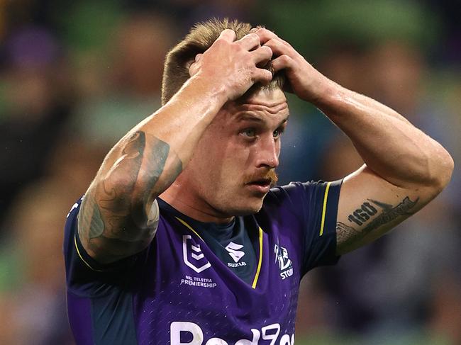 MELBOURNE, AUSTRALIA - APRIL 30:  Cameron Munster of the Storm reacts after missing a conversion during the round eight NRL match between the Melbourne Storm and the Cronulla Sharks at AAMI Park on April 30, 2021, in Melbourne, Australia. (Photo by Robert Cianflone/Getty Images)