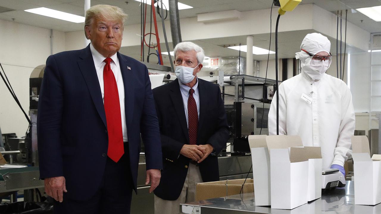 President Donald Trump tours a factory that makes medical swabs but refused to wear a face mask. Picture: AP