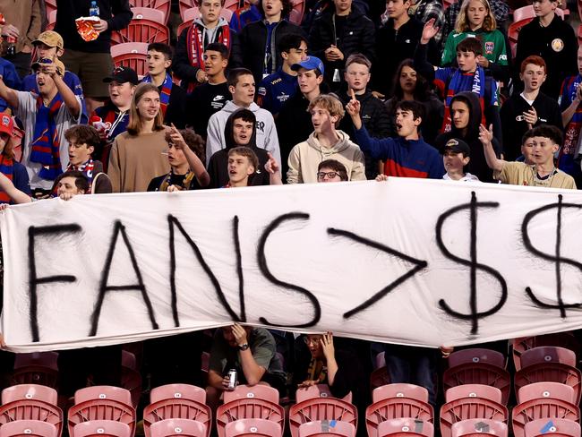 NEWCASTLE, AUSTRALIA - DECEMBER 16: Jets fans hold a sign in protest during the round eight A-League Men's match between Newcastle Jets and Brisbane Roar at McDonald Jones Stadium, on December 16, 2022, in Newcastle, Australia. (Photo by Brendon Thorne/Getty Images)